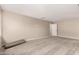Large open-concept living room with neutral carpeting and plenty of natural light at 15599 S 180Th Ln, Goodyear, AZ 85338