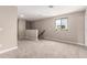 Spacious loft area with plush carpeting, skylight, and ample natural light at 15599 S 180Th Ln, Goodyear, AZ 85338
