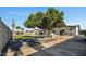 This backyard features a swimming pool, lush green grass, and is great for relaxing at 156 E Jasmine St, Mesa, AZ 85201