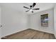 Bedroom features wood-look floors, a ceiling fan and good natural light at 156 E Jasmine St, Mesa, AZ 85201
