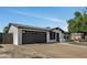 Charming single story home with a two car garage and well-maintained landscaping at 156 E Jasmine St, Mesa, AZ 85201