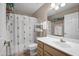 Functional bathroom with a sink, toilet, shower/tub combo, and plenty of towel racks at 16357 E Arrow Dr # 115, Fountain Hills, AZ 85268
