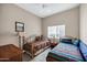 Shared bedroom featuring two twin beds, neutral decor, and a window with blinds at 16357 E Arrow Dr # 115, Fountain Hills, AZ 85268