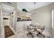 Dining area with chandelier lighting and four chairs, adjacent to kitchen at 16357 E Arrow Dr # 115, Fountain Hills, AZ 85268