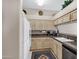 Traditional kitchen featuring light wood cabinets, modern appliances, and granite countertops at 16357 E Arrow Dr # 115, Fountain Hills, AZ 85268