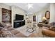 Spacious living room with ceiling fan, glass coffee table, and view of dining area at 16357 E Arrow Dr # 115, Fountain Hills, AZ 85268