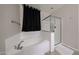 The bathroom features a soaking tub with a separate glass enclosed shower at 16930 W Woodlands Ave, Goodyear, AZ 85338