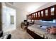 The bedroom has a wooden bunk bed and a desk with a personal computer at 16930 W Woodlands Ave, Goodyear, AZ 85338