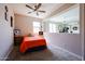 Upstairs bedroom with bright walls, a ceiling fan and clear separation of space at 16930 W Woodlands Ave, Goodyear, AZ 85338