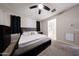 Main bedroom with carpet, ceiling fan, and an en suite bathroom at 16930 W Woodlands Ave, Goodyear, AZ 85338