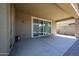 Covered patio with brick accents, offering outdoor living and bright sunlight at 16930 W Woodlands Ave, Goodyear, AZ 85338
