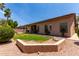 Well-manicured backyard with lush lawn, patio and mature trees offering privacy at 1884 E Stephens Dr, Tempe, AZ 85283
