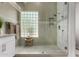 Bright bathroom showcasing glass shower, neutral tiling, and modern fixtures at 1884 E Stephens Dr, Tempe, AZ 85283