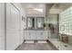 Elegant bathroom features a double vanity, a glass-enclosed shower, and ample lighting at 1884 E Stephens Dr, Tempe, AZ 85283