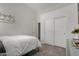 Simple bedroom featuring bed, closet with sliding doors and door to another room at 1884 E Stephens Dr, Tempe, AZ 85283