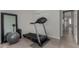 Well-lit exercise room featuring a treadmill, exercise ball, and mirror at 1884 E Stephens Dr, Tempe, AZ 85283