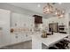 Bright, modern kitchen with white cabinetry, stainless steel appliances, and a stylish island with seating at 1884 E Stephens Dr, Tempe, AZ 85283