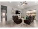 Bright living room with tile floors, comfortable seating, and a sliding glass door leading to an outdoor space at 1884 E Stephens Dr, Tempe, AZ 85283