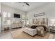 Cozy main bedroom with a rustic headboard, neutral decor, and private patio access at 1884 E Stephens Dr, Tempe, AZ 85283