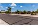 Scenic street view of a peaceful neighborhood with lush greenery and a community pond at 1884 E Stephens Dr, Tempe, AZ 85283