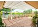 Covered back patio featuring brick columns, decorative steel, and an exposed aggregate patio at 19030 N Signal Butte Cir, Sun City, AZ 85373