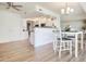 Open concept layout with dining area that flows into the kitchen and living room at 19030 N Signal Butte Cir, Sun City, AZ 85373