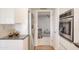 Contemporary kitchen with stainless steel appliances and an open view to the living area at 19030 N Signal Butte Cir, Sun City, AZ 85373