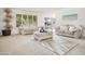 Cozy living room with comfortable seating, stylish decor, and a view of the backyard at 19030 N Signal Butte Cir, Sun City, AZ 85373