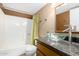 This bathroom features a sleek glass vessel sink, decorative shower curtain and neutral paint at 1926 E Sandra Ter, Phoenix, AZ 85022