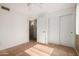 Bright bedroom featuring tile flooring, ample lighting and large closets at 1926 E Sandra Ter, Phoenix, AZ 85022