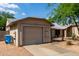 One-story home with a two-car garage and a well-maintained, drought-resistant yard at 1926 E Sandra Ter, Phoenix, AZ 85022
