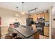 Bright kitchen featuring tile flooring, stainless steel appliances and bar seating area at 1926 E Sandra Ter, Phoenix, AZ 85022