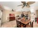 Bright open concept kitchen dining area with tile flooring and ceiling fans at 1926 E Sandra Ter, Phoenix, AZ 85022