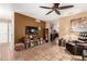 Open-concept living room with terracotta floors, a media center, and comfortable seating at 1926 E Sandra Ter, Phoenix, AZ 85022