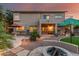 Exterior shot of the backyard with pool, patio area, manicured landscaping, and outdoor seating at 194 E Canyon Creek Dr, Gilbert, AZ 85295
