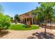 Large backyard with artificial turf and a play structure, featuring a large patio area at 194 E Canyon Creek Dr, Gilbert, AZ 85295