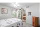 Bedroom with white walls, ceiling fan, closet with mirrored doors, and double-hung windows at 194 E Canyon Creek Dr, Gilbert, AZ 85295