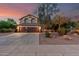 Beautiful two-story home featuring a three-car garage, well-maintained landscaping, and a spacious driveway at 194 E Canyon Creek Dr, Gilbert, AZ 85295