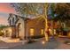 Lovely home with attractive landscaping, exterior lighting, and mature trees, creating an inviting curb appeal at 194 E Canyon Creek Dr, Gilbert, AZ 85295