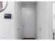 Clean white hallway featuring doors, neutral paint, and modern accents at 194 E Canyon Creek Dr, Gilbert, AZ 85295