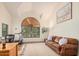 Inviting home office with a leather sofa, office desk, and chair for a productive and comfortable workspace at 194 E Canyon Creek Dr, Gilbert, AZ 85295