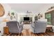 Cozy living room featuring comfortable chairs and a ceiling fan for a relaxing atmosphere at 194 E Canyon Creek Dr, Gilbert, AZ 85295