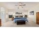 A relaxing main bedroom with a comfy king bed, stylish lamps, and views of the tranquil scenery at 194 E Canyon Creek Dr, Gilbert, AZ 85295