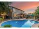 An inviting pool, outdoor patio, and seating area creating a relaxing backyard retreat at 194 E Canyon Creek Dr, Gilbert, AZ 85295