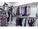 A well-organized walk-in closet with ample shelving and hanging space for clothing and accessories at 194 E Canyon Creek Dr, Gilbert, AZ 85295