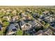 Aerial shot showcasing a community with pools, covered patios, and solar panels, emphasizing outdoor living and sustainability at 2556 E Quiet Hollow Ln, Phoenix, AZ 85024