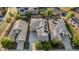 Aerial view of house featuring a backyard pool, solar panels and desert landscaping in a sunny neighborhood at 2556 E Quiet Hollow Ln, Phoenix, AZ 85024