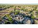 Overhead perspective showcasing community with pools, covered patios, and solar panels, emphasizing outdoor lifestyle and green living at 2556 E Quiet Hollow Ln, Phoenix, AZ 85024