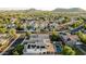 High-altitude shot of neighborhood with pools, patios, and solar panels, emphasizing community charm, and energy-efficient homes at 2556 E Quiet Hollow Ln, Phoenix, AZ 85024