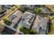Aerial view of house featuring a backyard pool, solar panels and desert landscaping in a sunny neighborhood at 2556 E Quiet Hollow Ln, Phoenix, AZ 85024